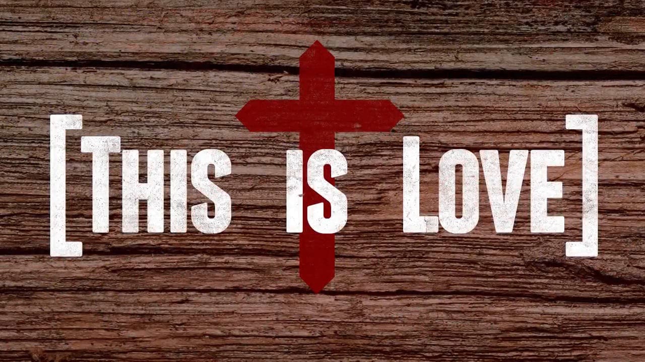 This is love. Image a of a cross on a piece of wood.