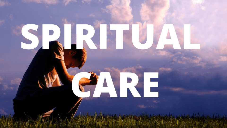 Spiritual care - man kneeling on the ground in prayer.